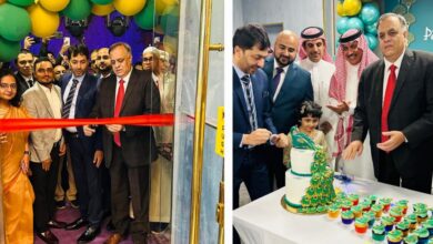 Dr Suhel Khan cuts ribbon and cake at Peacock Restaurant’s Riyadh opening with Indian and Saudi guests.