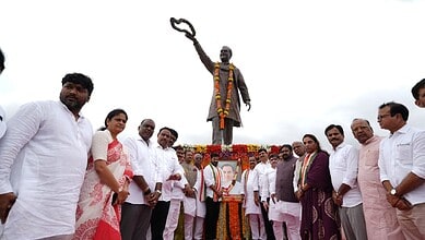 Revanth Reddy offering tribute at Rajiv Gandhi's statue at the State Secretariat