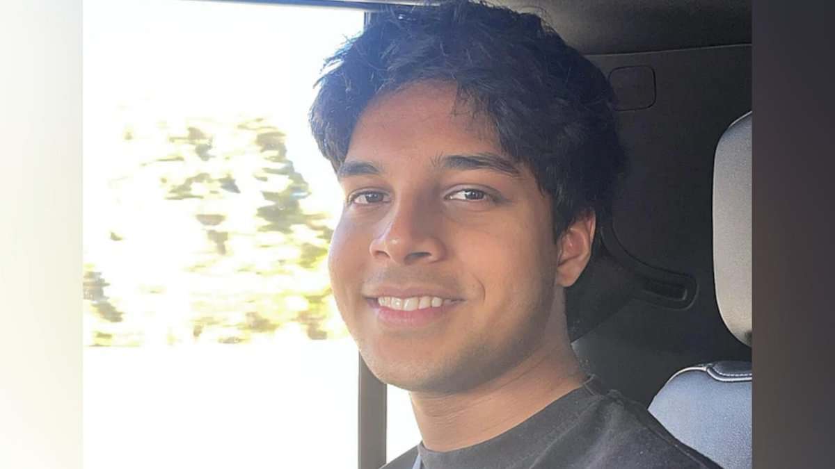 Image of Wayne Nash D’Souza, an 18-year-old Indian expat student and Dubai Duty-Free million-dollar draw winner, smiling inside a car.