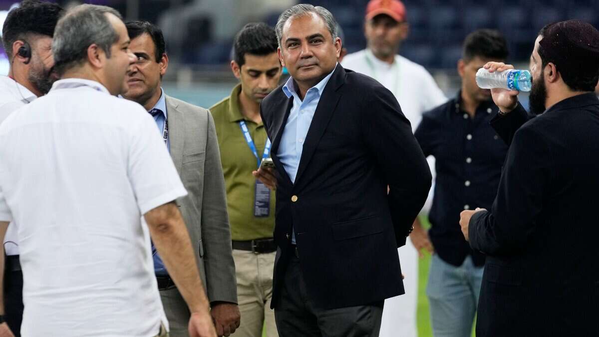 Pakistan's Minister of Interior Mohsin Naqvi, center, stands with officials on the field after India won the Asia Cup cricket final against Pakistan at Dubai International Cricket Stadium, United Arab Emirates, Sunday, Sept. 28, 2025. (AP /PTI)