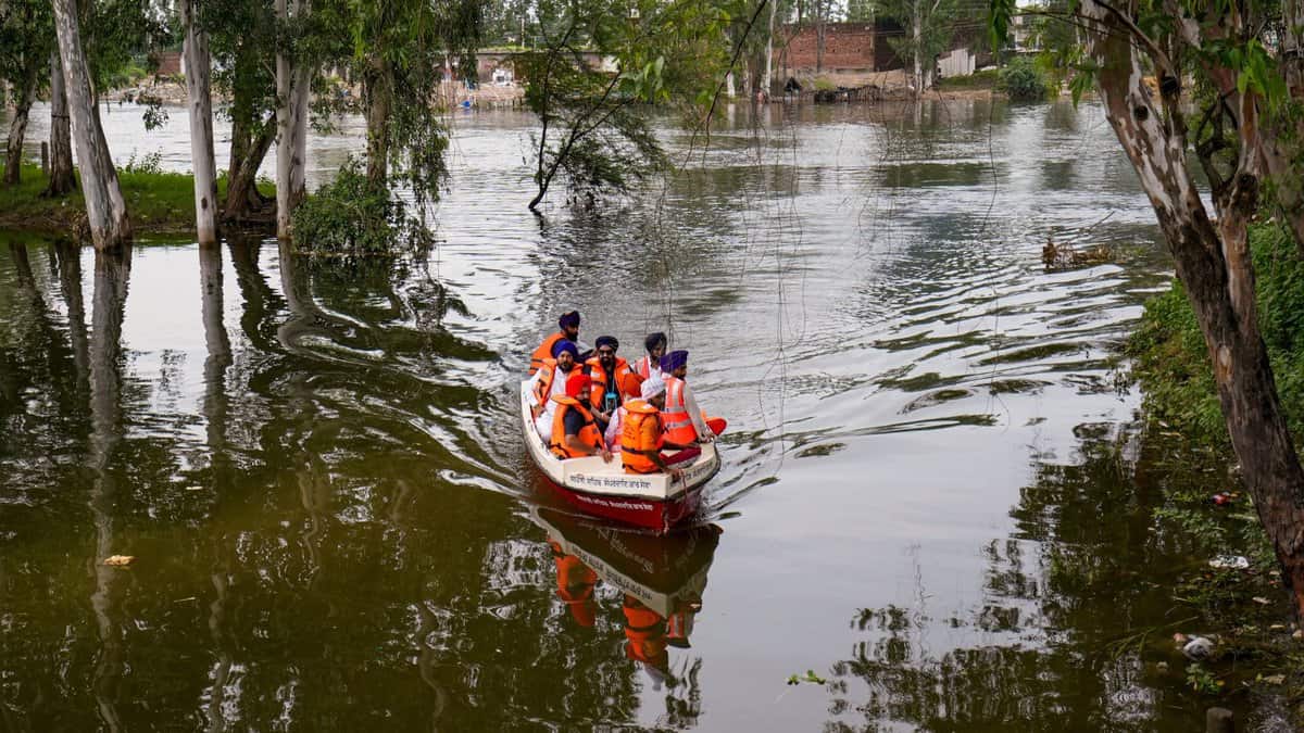 Residents at a flood-affected area, at Ajnala in Amritsar district, Punjab