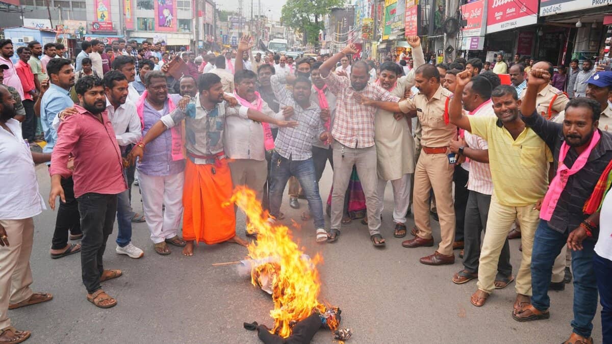 BRS workers burn an effigy of CM Revanth Reddy near its party headquarters in Hyderabad on Monday