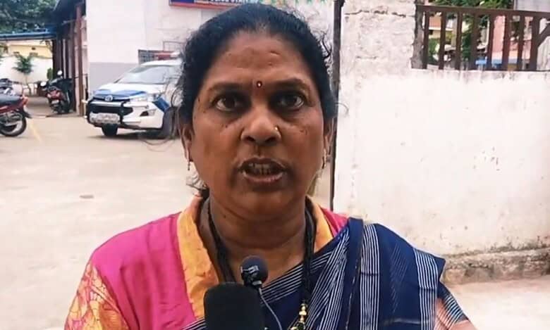 A woman addresses the media after her family was attacked in Attapur