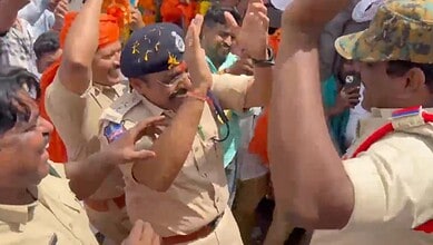 police officials dance during Ganesh idol procession in Hyderabad