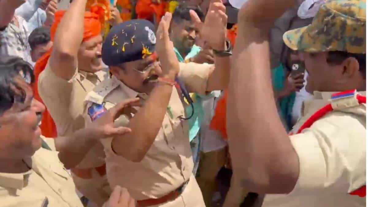 police officials dance during Ganesh idol procession in Hyderabad