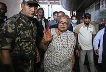 Nepal's interim Prime Minister Sushila Karki, center, arrives to meet the victims of the anti-government protests at a trauma center in Kathmandu, Nepal on Saturday. (PTI Photo/Arun Sharma)