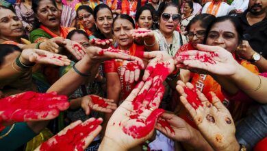 Shiv Sena (UBT) workers show their sindoor-smeared hands during a protest against the India-Pakistan Asia Cup cricket match in Navi Mumbai on Sunday. (PTI Photo)