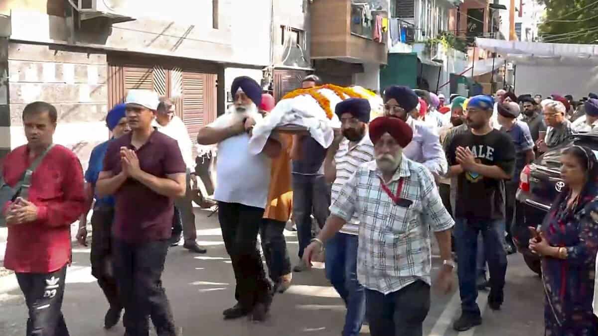 Mortal remains of Department of Economic Affairs Deputy Secretary Navjot Singh, who was killed in a road accident involving a BMW car, being brought to his residence in New Delhi on Tuesday (PTI Photo)