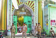 Police personnel stand guard outside a dargah in Bareilly, Uttar Pradesh (PTI Photo)