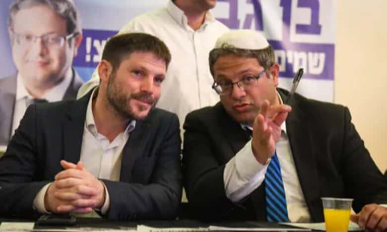 Israeli ministers Bezalel Smotrich (left) and Itamar Ben-Gvir (right) seated side by side during a meeting.