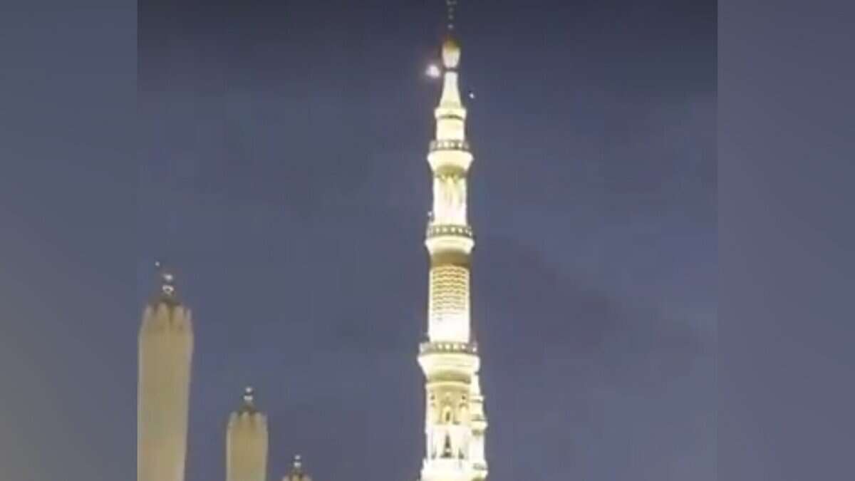 Minaret of the Prophet’s Mosque in Madinah at night with a light in the sky, linked to interception of an unauthorised drone.