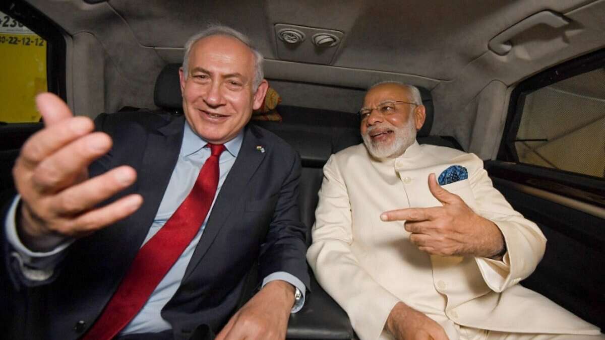 Indian Prime Minister Narendra Modi and Israeli Prime Minister Benjamin Netanyahu sharing a light moment in a car during Modi's visit to Israel, July 2017.