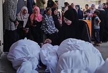Palestinians mourn during a funeral for victims killed in an Israeli airstrike in Gaza.