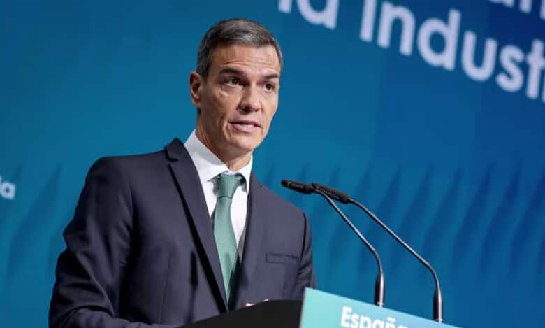 Spain’s Prime Minister Pedro Sanchez speaking at a podium.