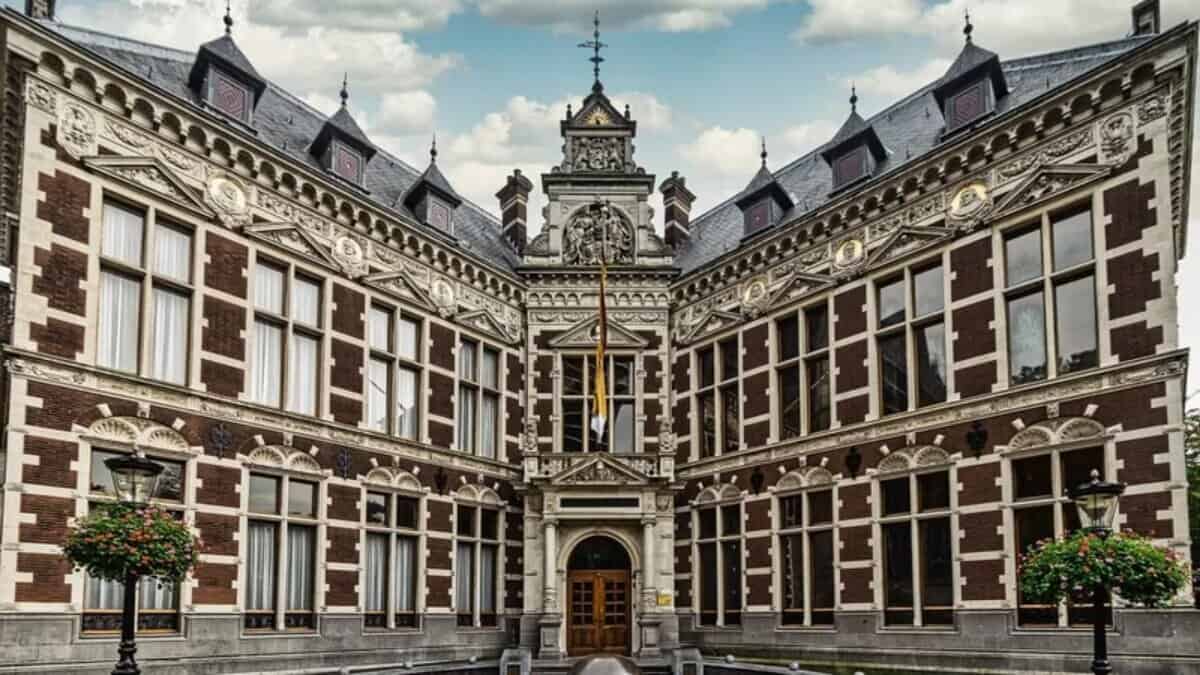 Historic main building of Utrecht University with ornate architecture and symmetrical design.