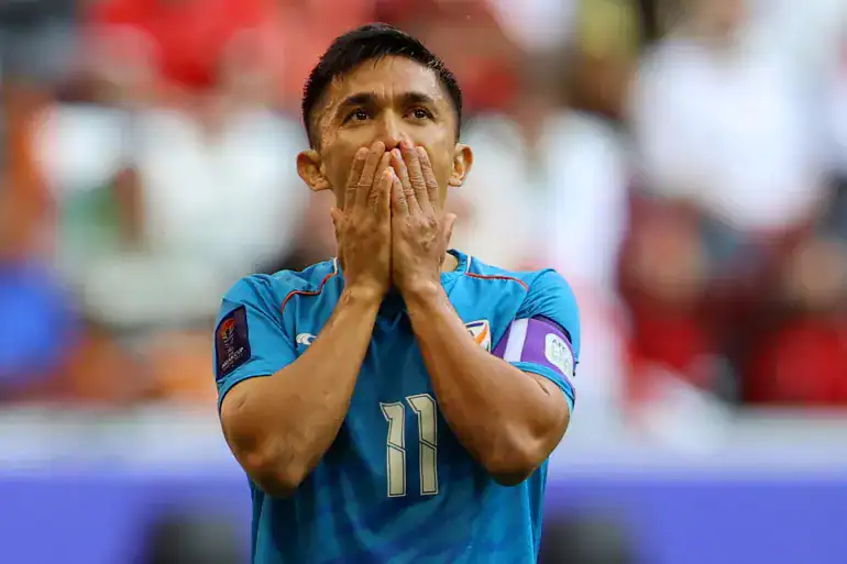 Indian Footballer dejected on the football field