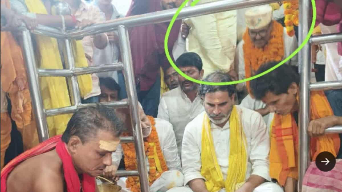 Photo of political strategist Prashant Kishor and a Muslim candidate sitting inside the temple's sanctum, which later caused a controversy and led to the sanctum being cleaned.