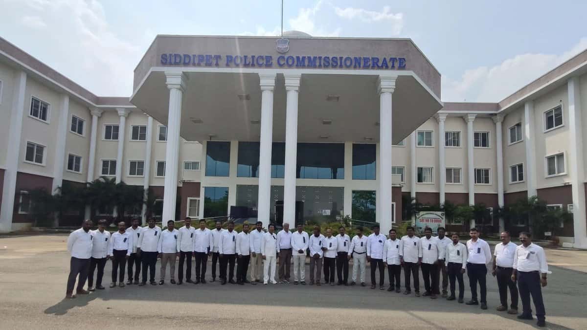 The image shows advocates from Siddipet protesting with black badges in front of Siddipet Police Commissionerate recently, demanding action against two advocates who allegedly insulted the Chief Justice of India BR Gavai in a WhatsApp group of advocates.
