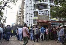 Mumbai: People gather at the site where 19 persons including 17 children were rescued from a studio in Powai area while the man who had held them hostage succumbed to bullet injuries sustained during the operation, in Mumbai, Thursday, Oct. 30, 2025. (PTI Photo)
