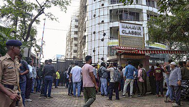 Mumbai: People gather at the site where 19 persons including 17 children were rescued from a studio in Powai area while the man who had held them hostage succumbed to bullet injuries sustained during the operation, in Mumbai, Thursday, Oct. 30, 2025. (PTI Photo)