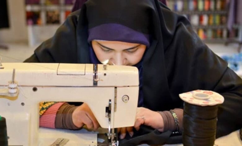 Sewing enthusiast working on a tailored garment using a vintage sewing machine. Crafting, fashion design, and tailoring skills showcased.