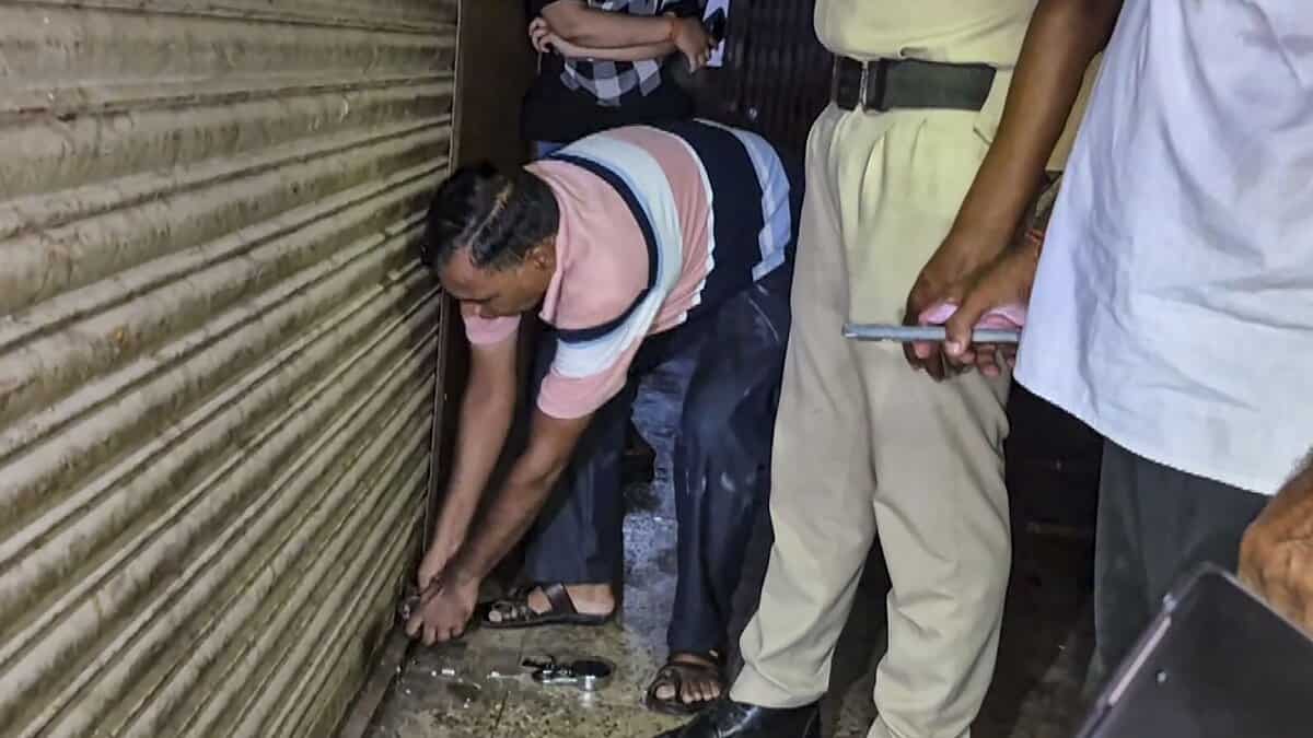 Officials seal office of a firm, that allegedly supplied Coldrif cough syrup, after a raid, in Jabalpur, Madhya Pradesh. (PTI Photo)