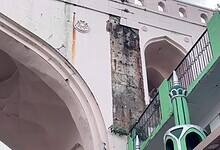 A piece of lime plaster, in Charminar, collapsed on a local gravely injuring him