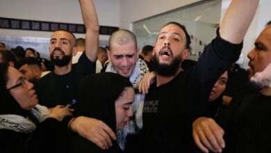 Freed Palestinians are greeted by their families in Ramallah [Mussa Qawasma/Reuters]