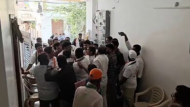 Congress workers grab each other collars during the bypoll campaign at Rahmathnagar area on Tuesday