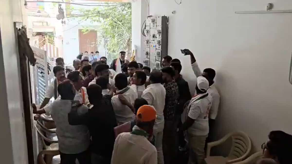 Congress workers grab each other collars during the bypoll campaign at Rahmathnagar area on Tuesday