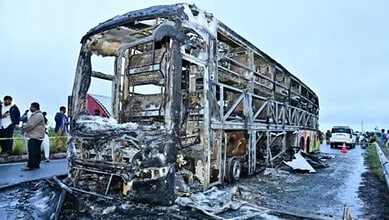 The bus was charred after a collision with bike
