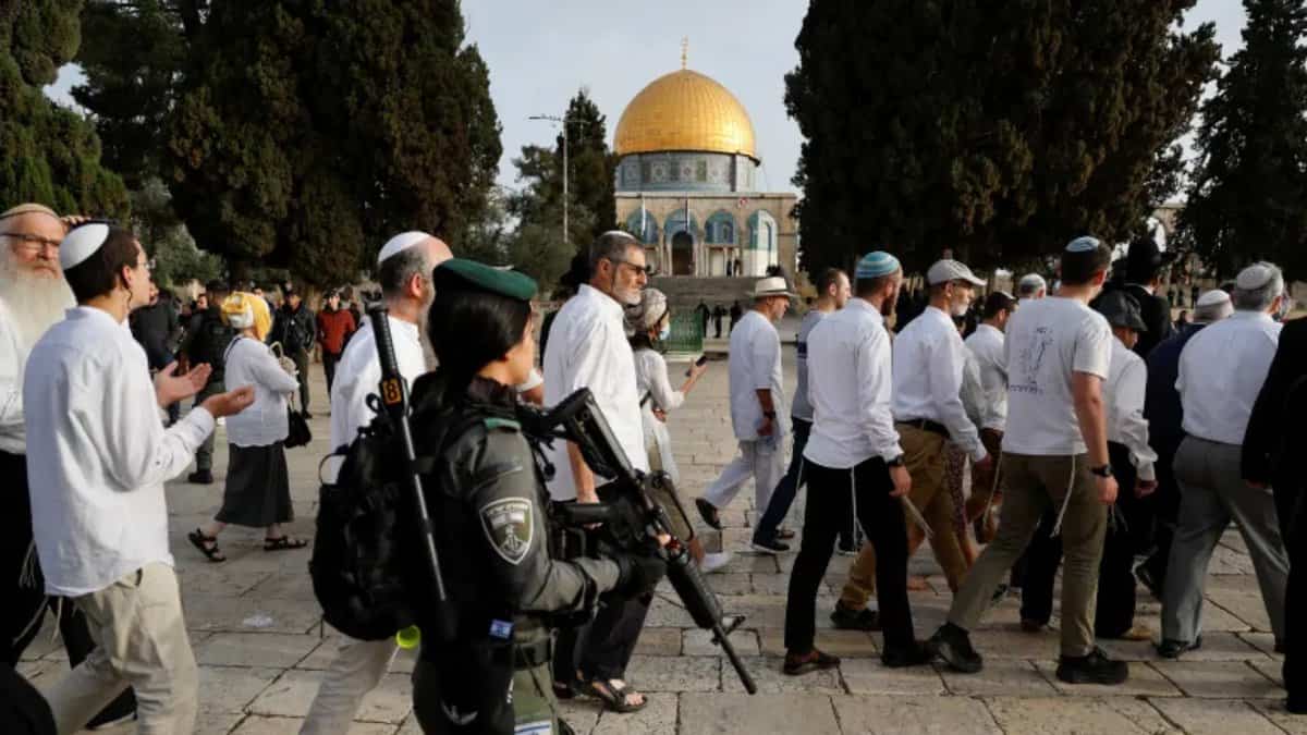 Israeli police escort Jewish settlers during a visit to the Al-Aqsa Mosque compound in Jerusalem’s Old City.