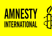Logo of Amnesty International featuring a candle wrapped in barbed wire on a yellow background.