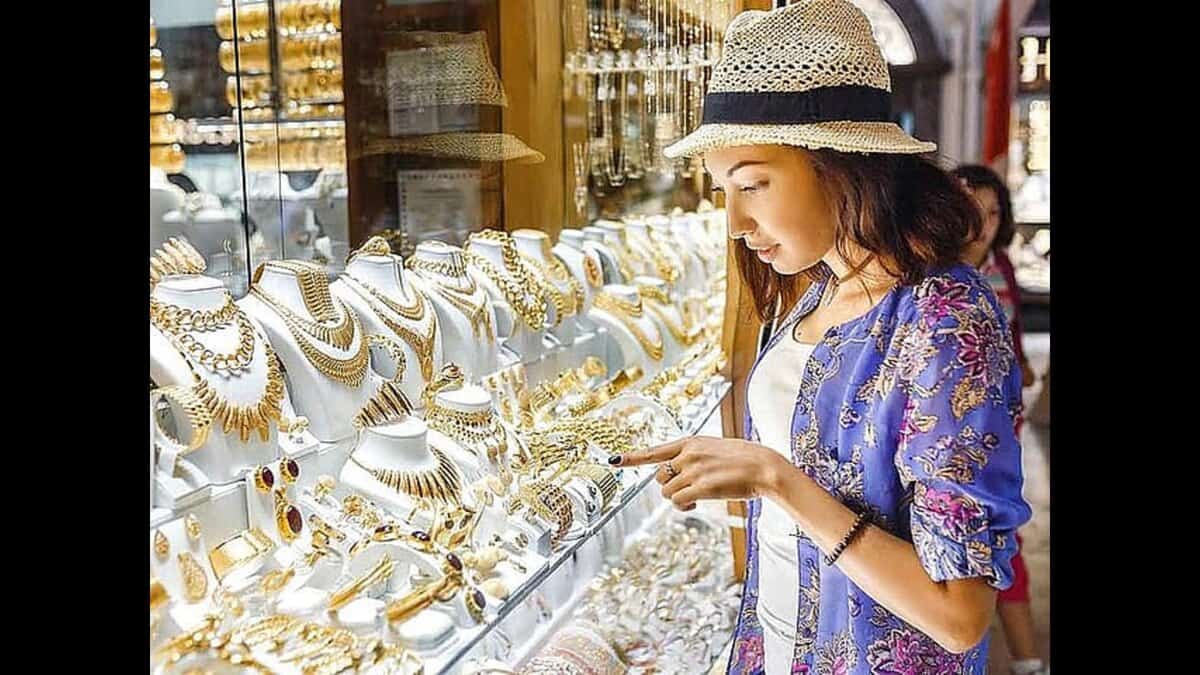 A woman examines gold jewellery on display at a shop in Dubai’s Gold Souk.