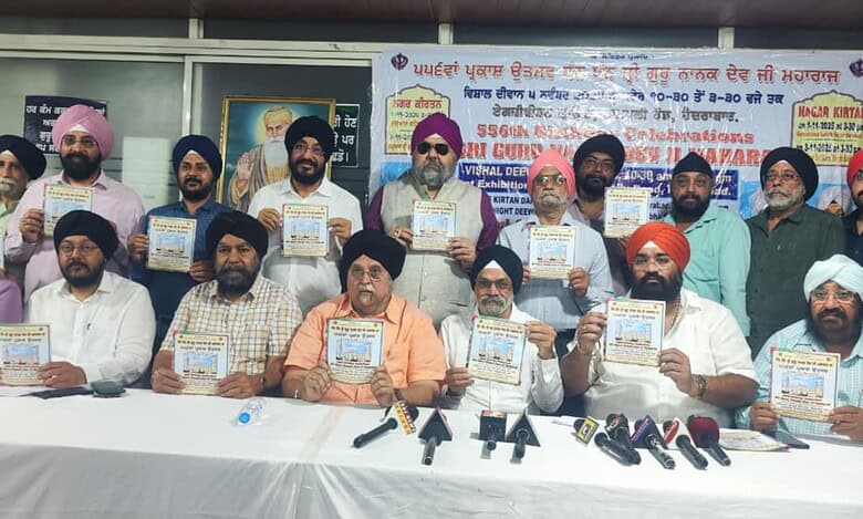 Members of Gurudwara Prabhandak committees release a brochure in connection with 556th Prakash Utsav (Birthday Celebrations) of Guru Nanak Devji.