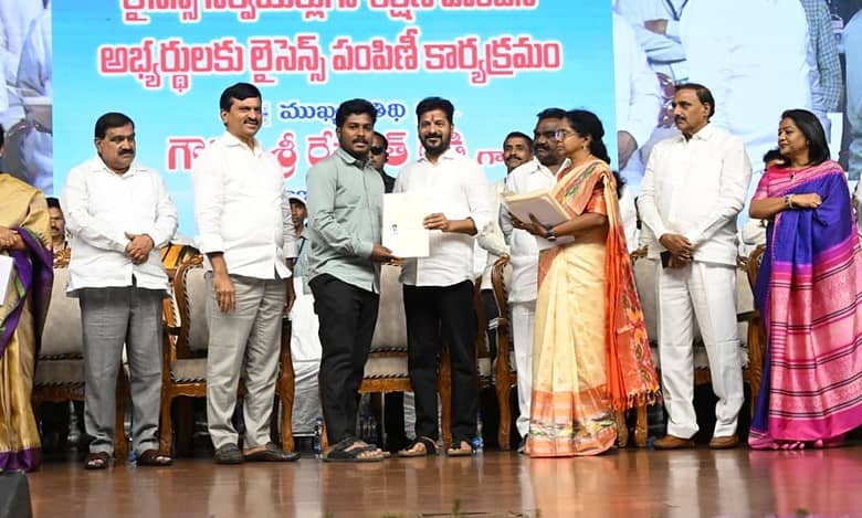 Chief Minister A Revanth Reddy distributes licenses to trained land surveyors in Hyderabad