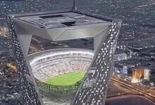 A digital image shows a football stadium inside the top of a tall tower in Saudi Arabia’s NEOM city.