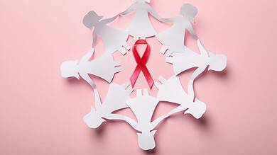 paper women and pink rbbon for cancer awareness