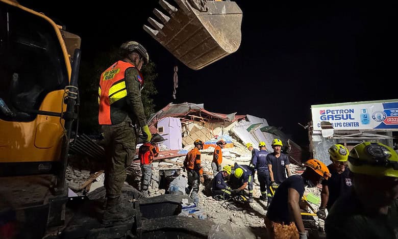 Rescuers search for survivors underneath rubble in Bogo city, Philippines, Wednesday, Oct. 1, 2025. AP/PTI