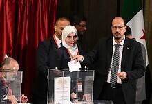 A member of Syria’s local committees casts his vote during the country’s interim parliament selection process in Damascus, October 5, 2025.