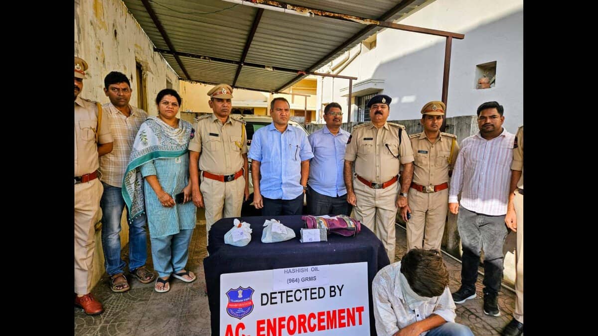 Telangana excise department officials display the seized hash oil