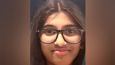 Image of Indian expat student Sera Maria Rajeesh wearing glasses and smiling slightly.