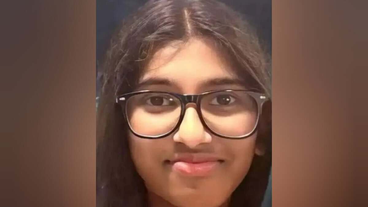 Image of Indian expat student Sera Maria Rajeesh wearing glasses and smiling slightly.