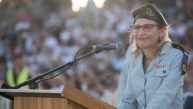 Israeli military lawyer Yifat Tomer-Yerushalmi speaking at a podium in uniform.