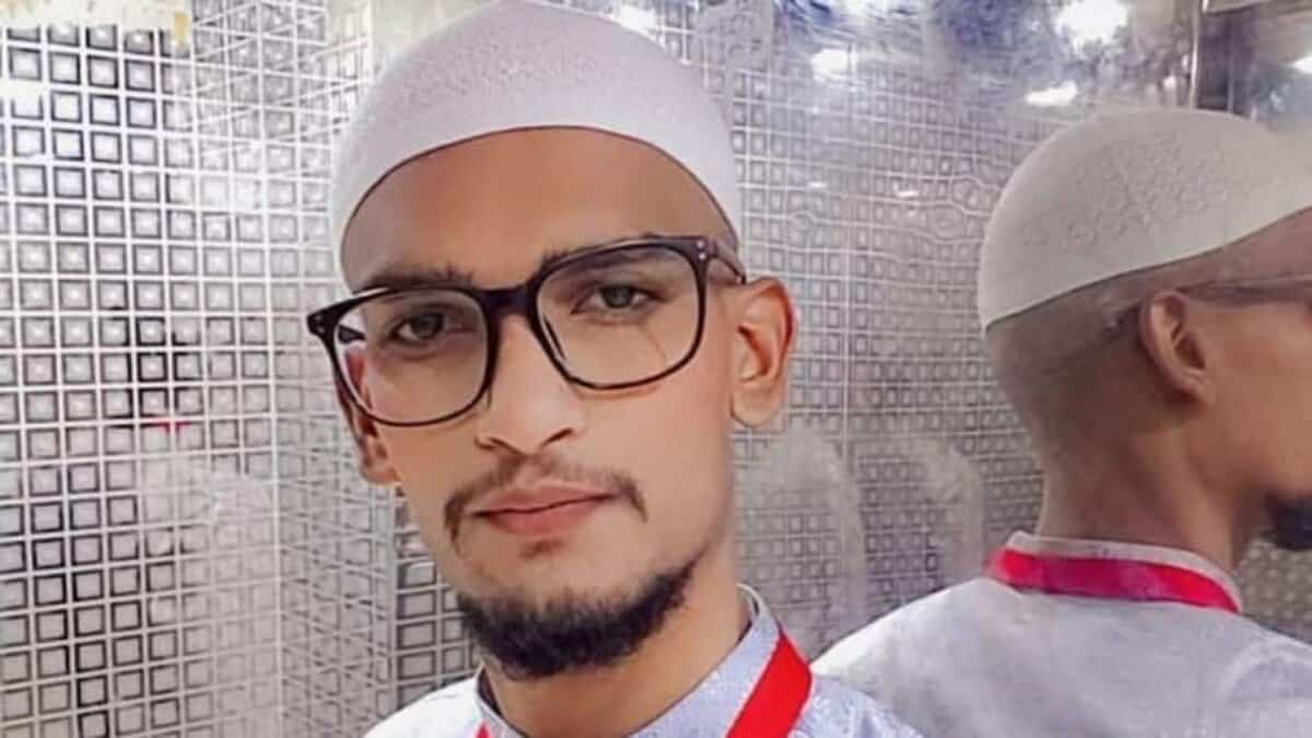 Mohammed Abdul Shoeb wearing glasses and a white prayer cap.