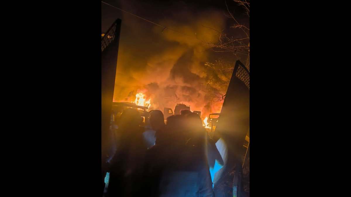People gather after a blast at a police station in Jammu Kashmir