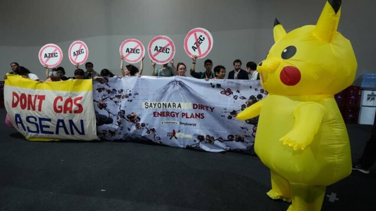 Activists, and one dressed in a Pikachu costume, protest Japan's financing of coal and natural gas projects during the COP30 U.N. Climate Summit, Friday, Nov. 14, 2025, in Belem, Brazil. (AP Photo)