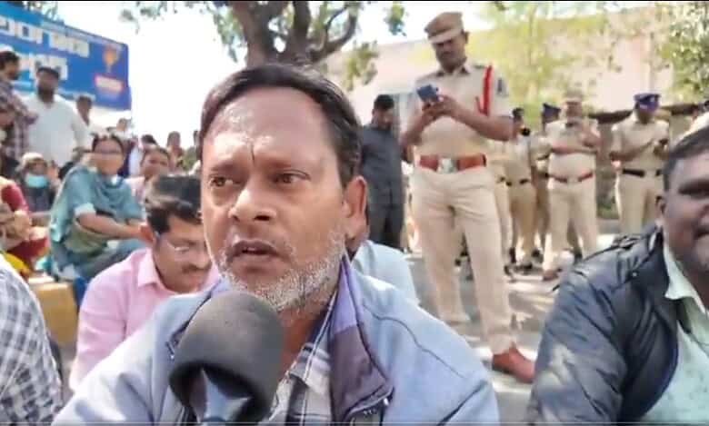 An NHM employee speaks to the media during protest in Hyderabad