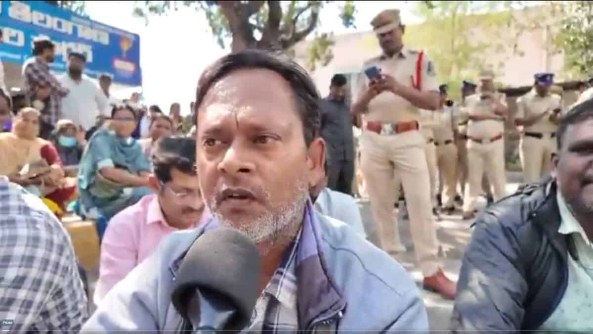 An NHM employee speaks to the media during protest in Hyderabad