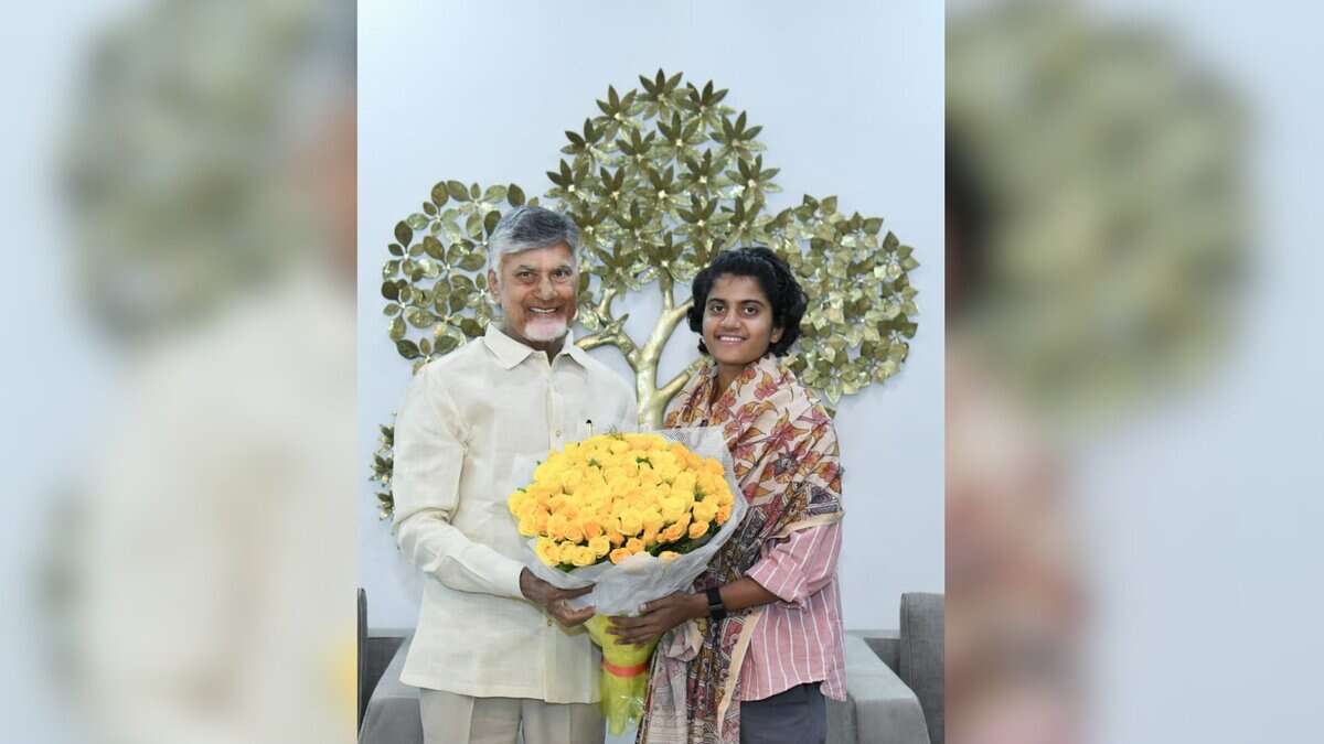 Andhra Pradesh Chief Minister N Chandrababu Naidu with cricketer Shree Charani